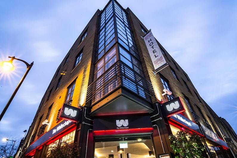 The hotel's corner entrance on New Road, seen from the pavement